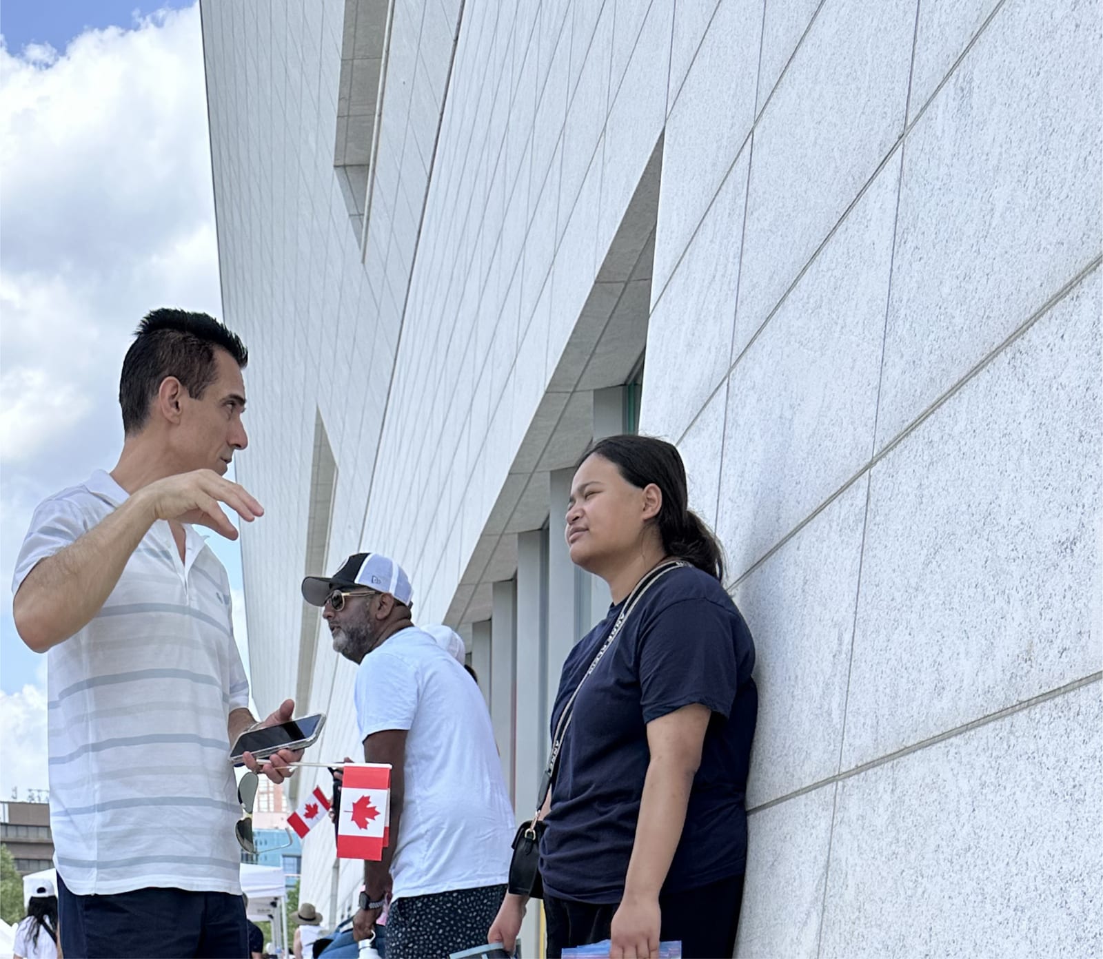 Sinan Erdemir speaking with residents at a Canada Day community event