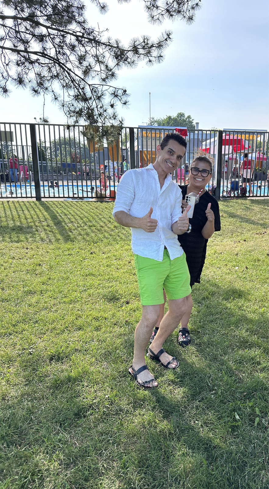 Sinan Erdemir and a supporter giving thumbs up at a summer community event